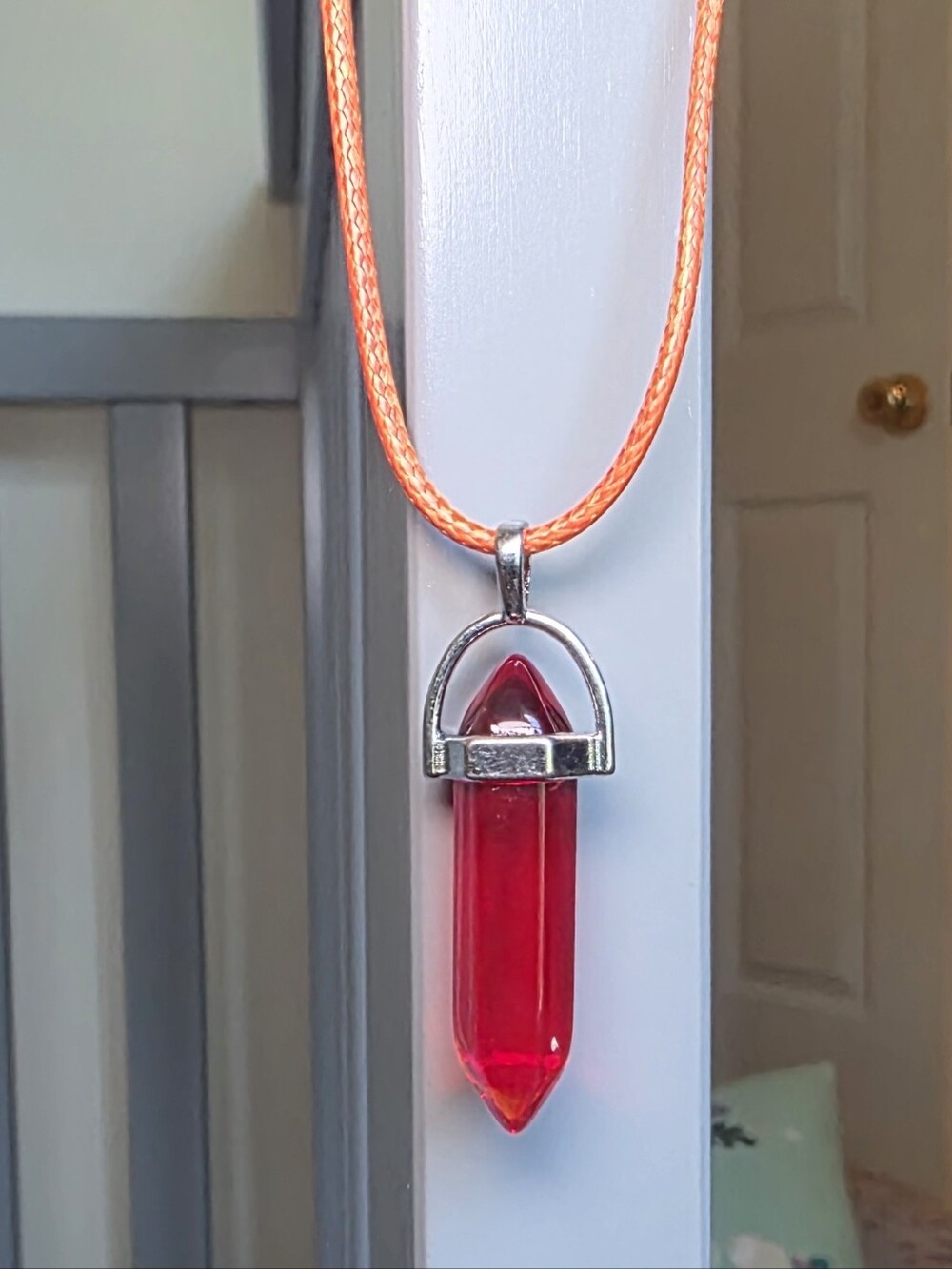 Elegant Red Crystal Point Pendant On Orange Cord Necklace